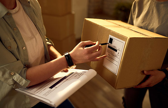 Two people checking a package